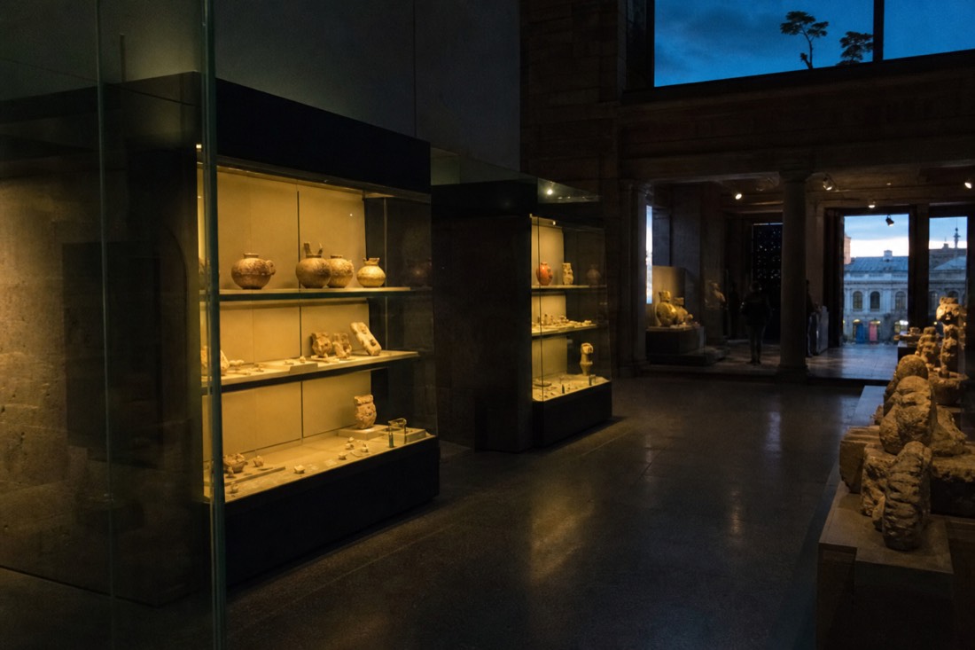 Visitors around the Aztec Sun Stone in the Mexica hall of the Anthropology Museum