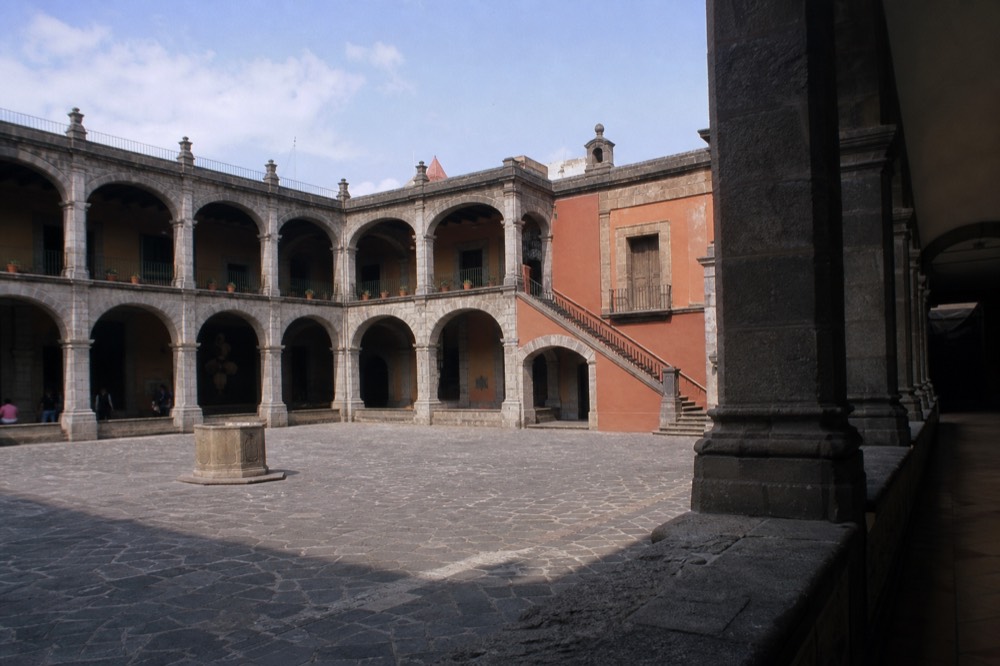 An arcaded stone courtyard inside the old colonial mint that houses the Museo Nacional de las Culturas del Mundo